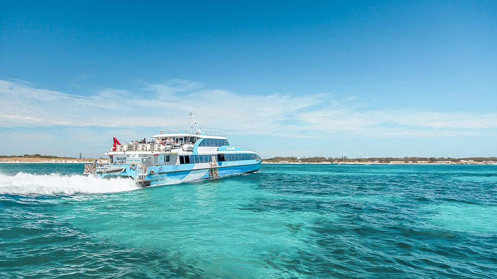 A white SeaLink fast ferry crossing turquoise water off Rottnest Island, from the ferry and admission ticket listing